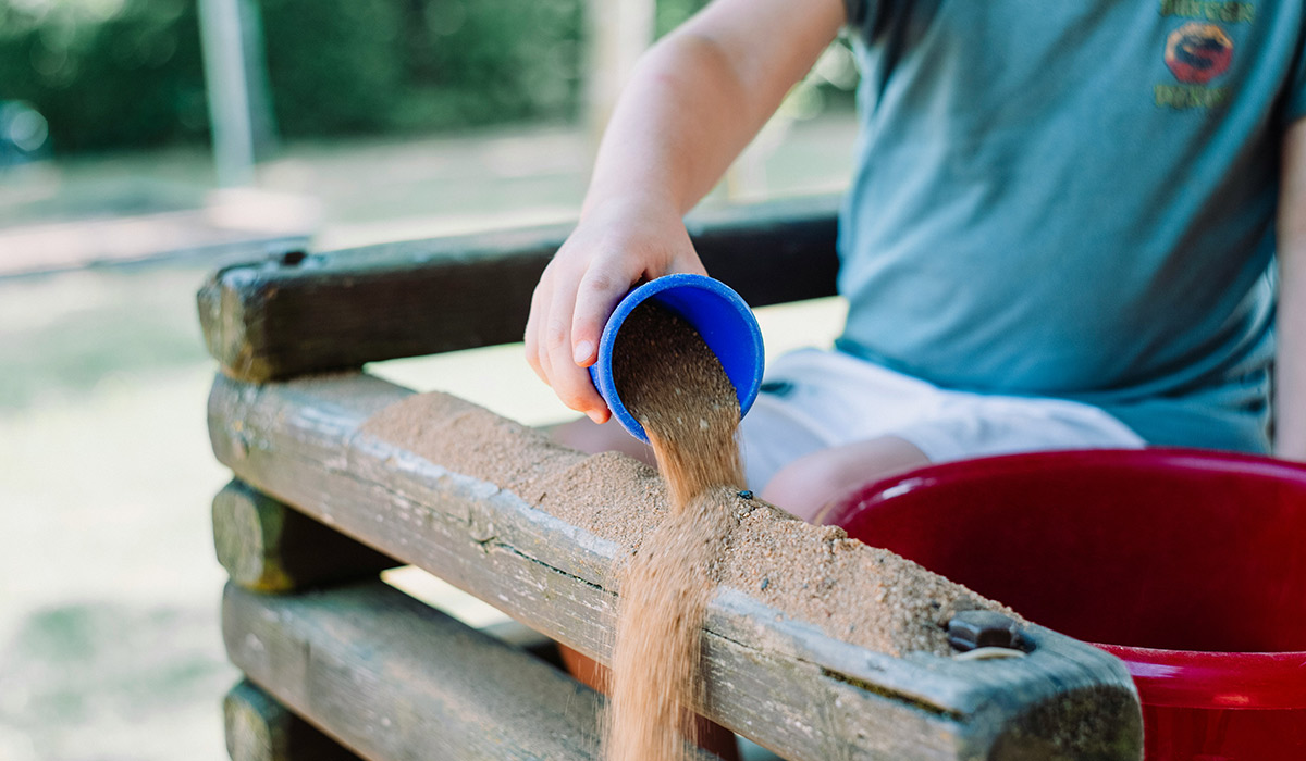 child playing wth sand